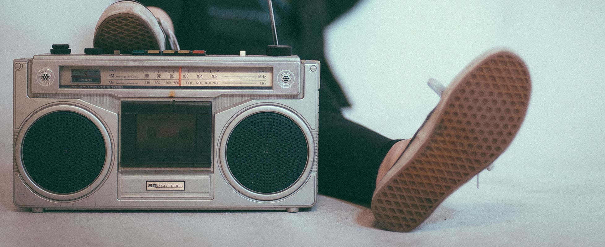 boombox playing music with someone lounging boombox playing music with someone lounging