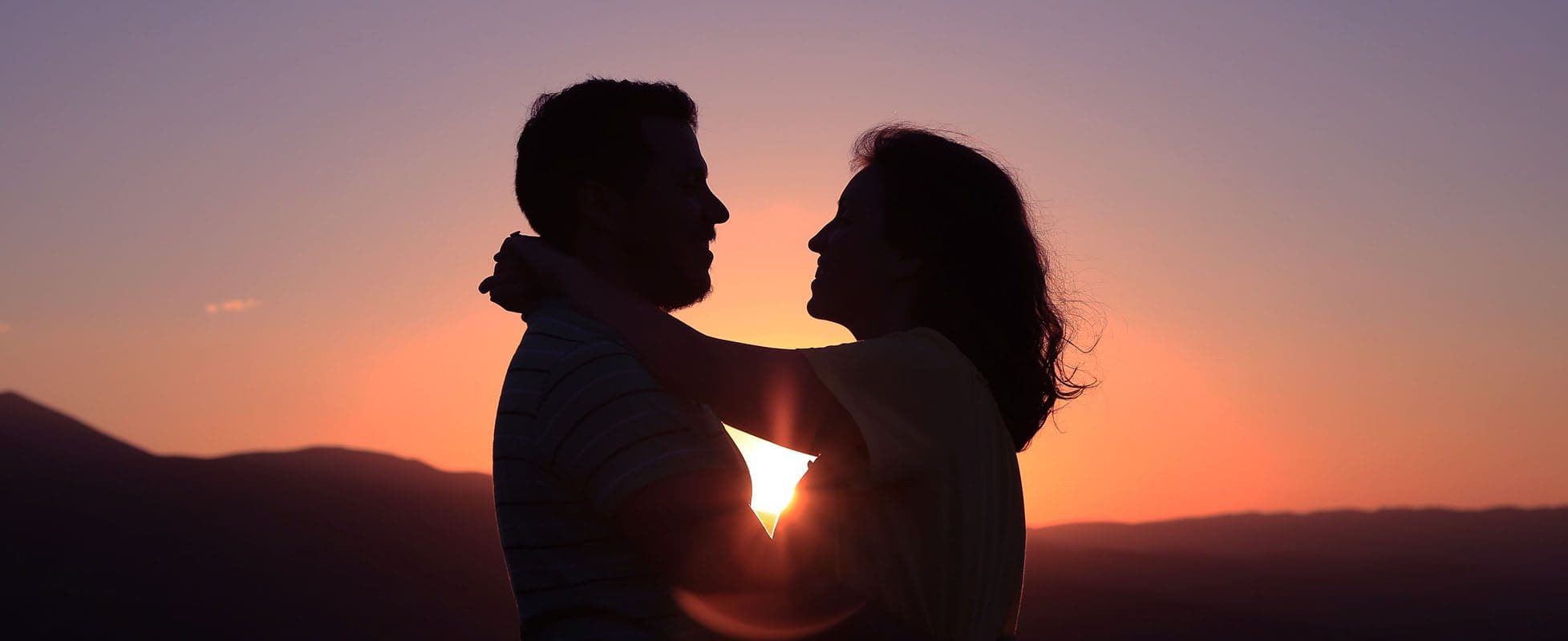 couple silhoutte during sunset couple silhoutte during sunset