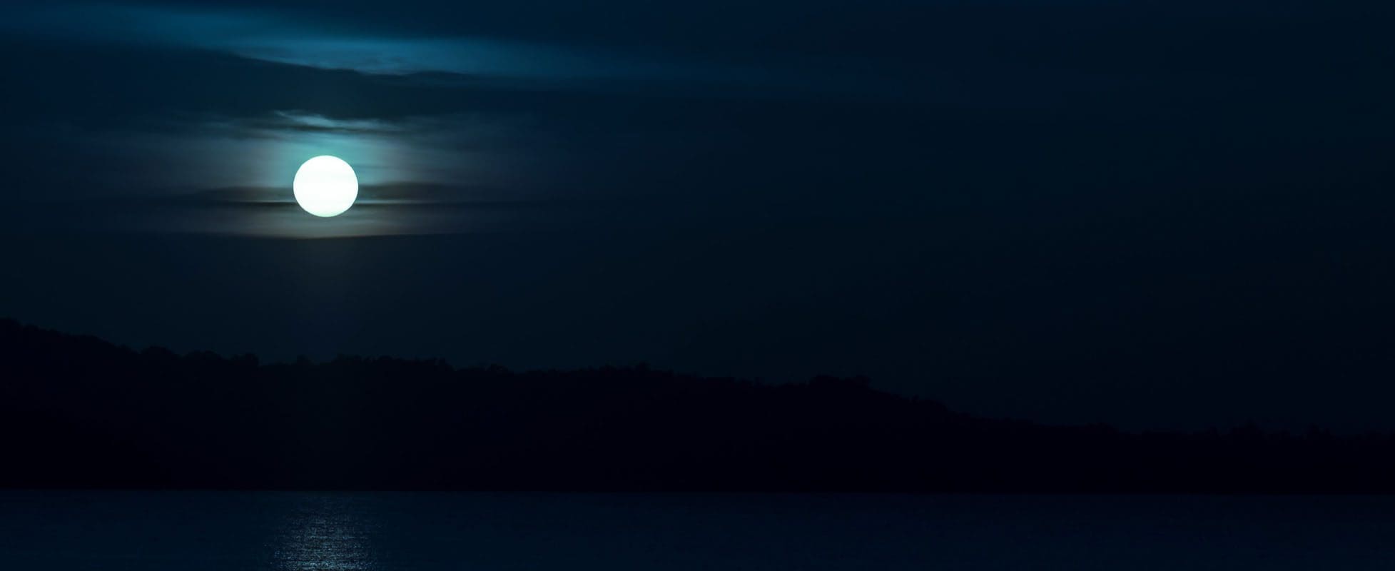full moon beaming over lake full moon beaming over lake