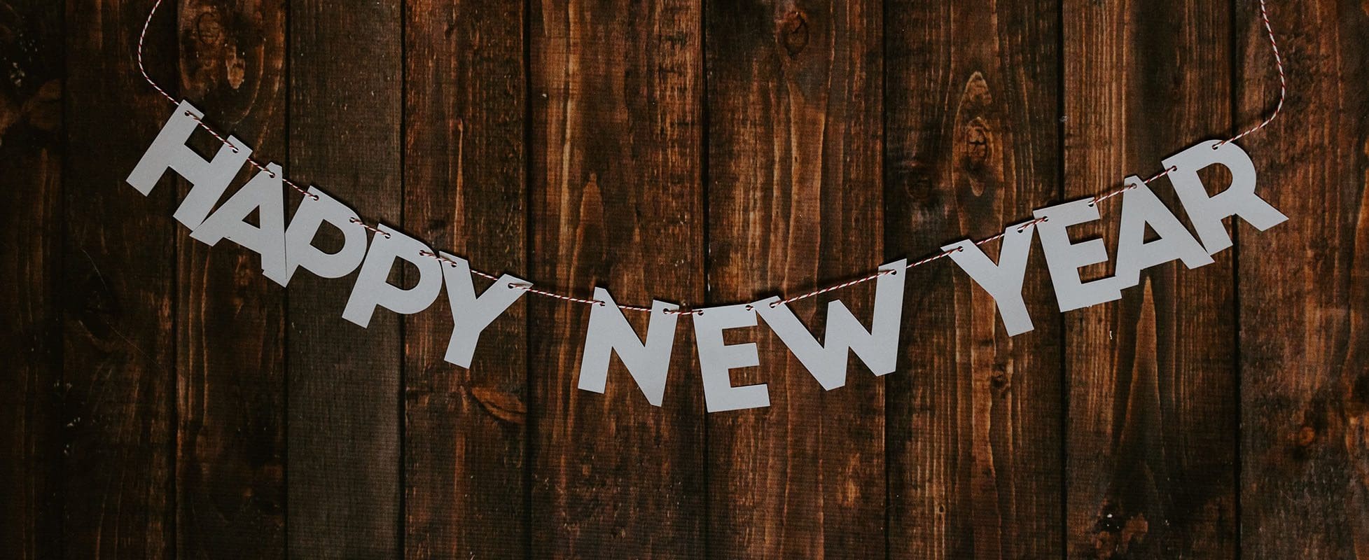 happy new year banner on wood background happy new year banner on wood background