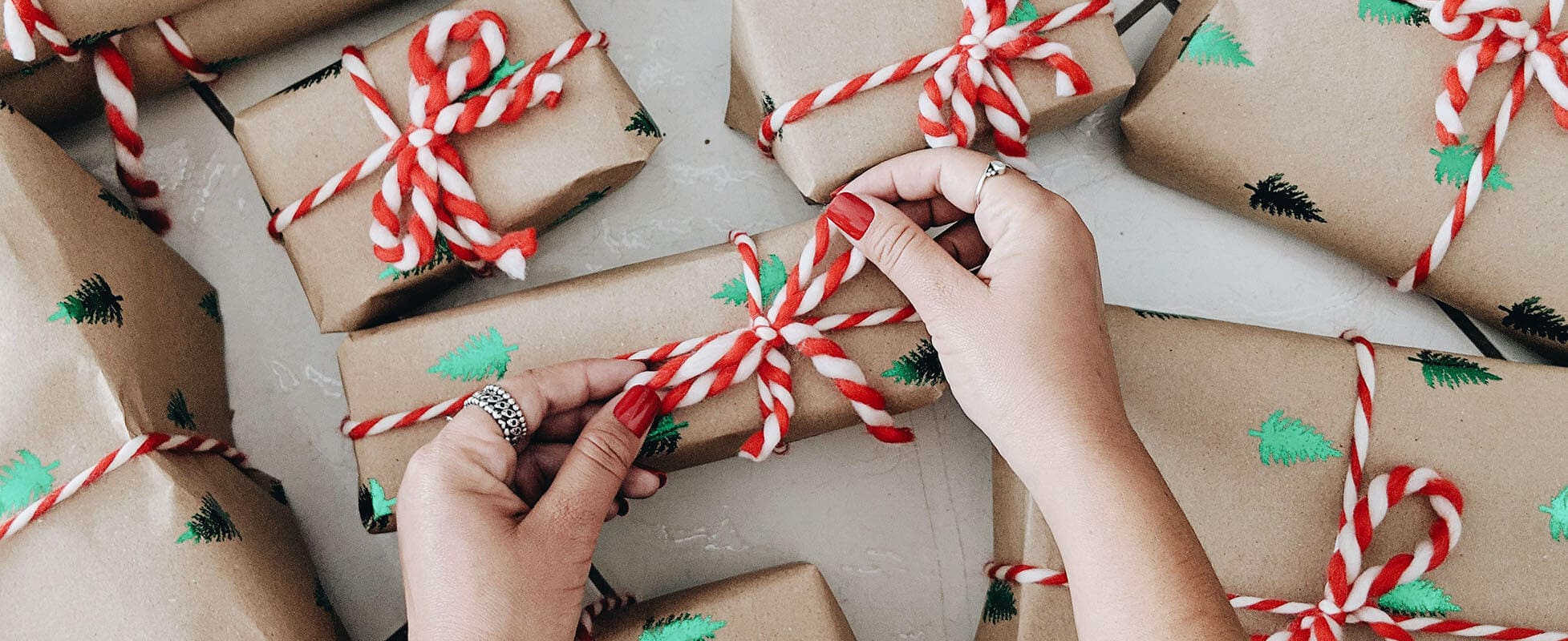 woman wrapping christmas gifts woman wrapping christmas gifts