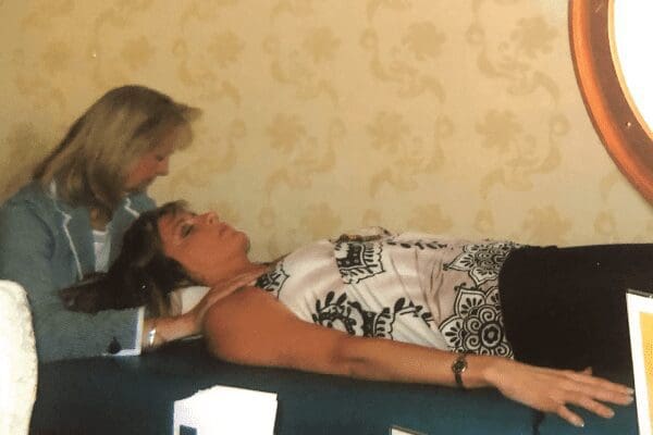 Kathy performing Reiki Energy Healing on client